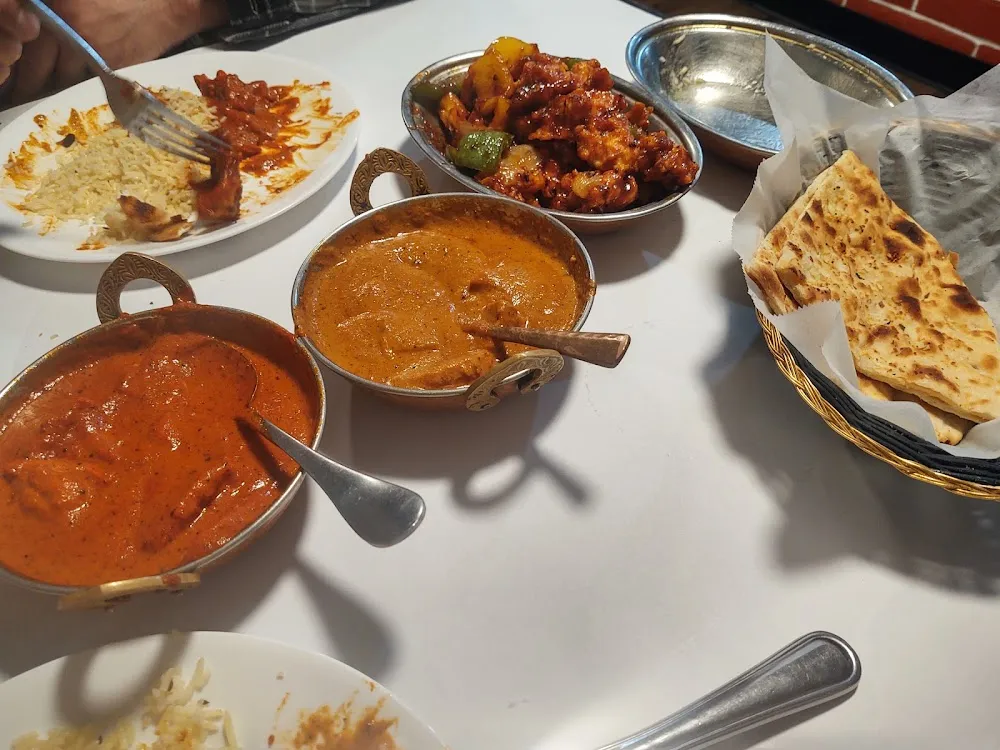 Garlic Naan Rice Chili Chicken Tiki Masala Chicken & Butter Chicken